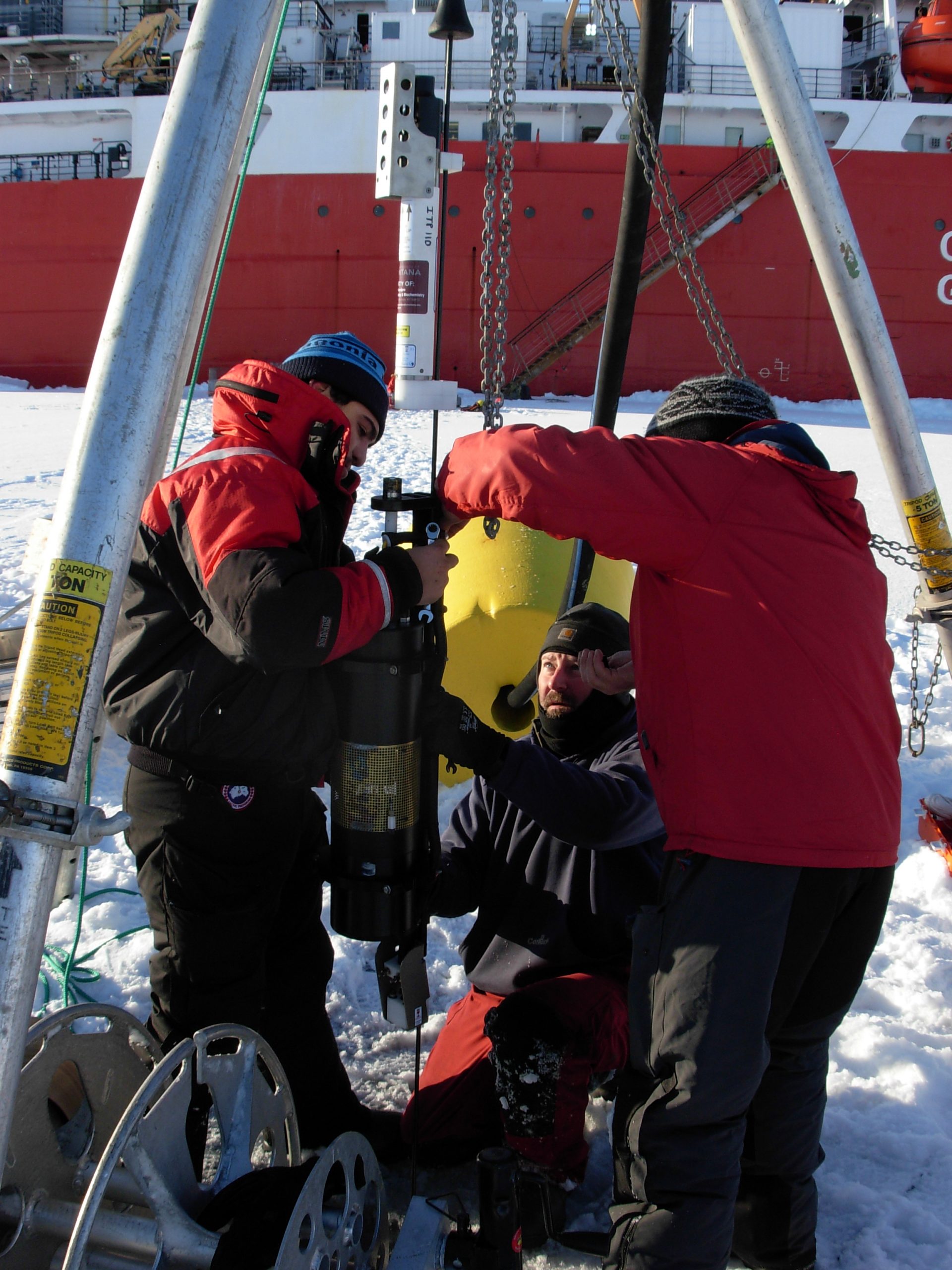 The SAMI sensor is mounted to the ITP wire by Llanos, Cory Beatty, and O’Brien. (Photo by Rick Krishfield)