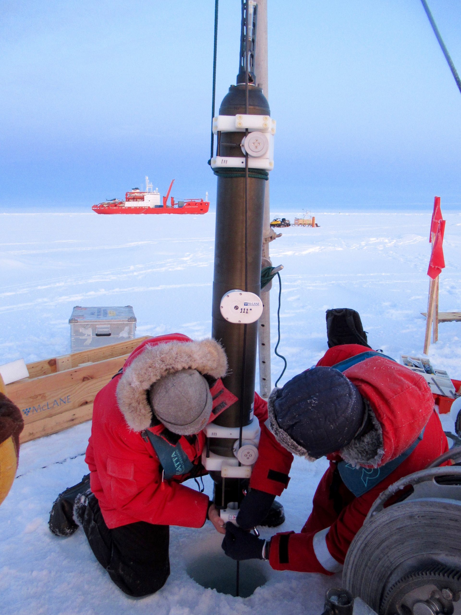 Mounting ITP 111 to the mooring wire for deployment. (Photo by Chris Basque)