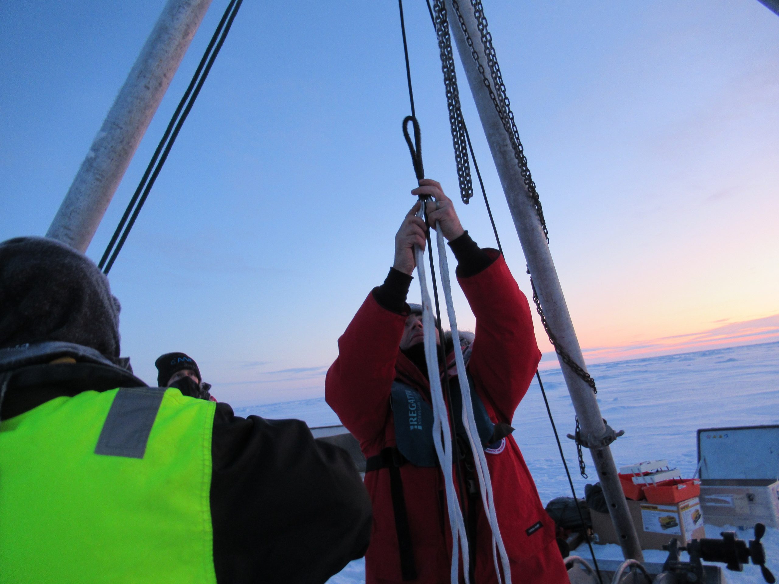 Attaching a Yale grip to the mooring wire to slip the final portion of the buoy into the water. (Photo by Chris Basque)