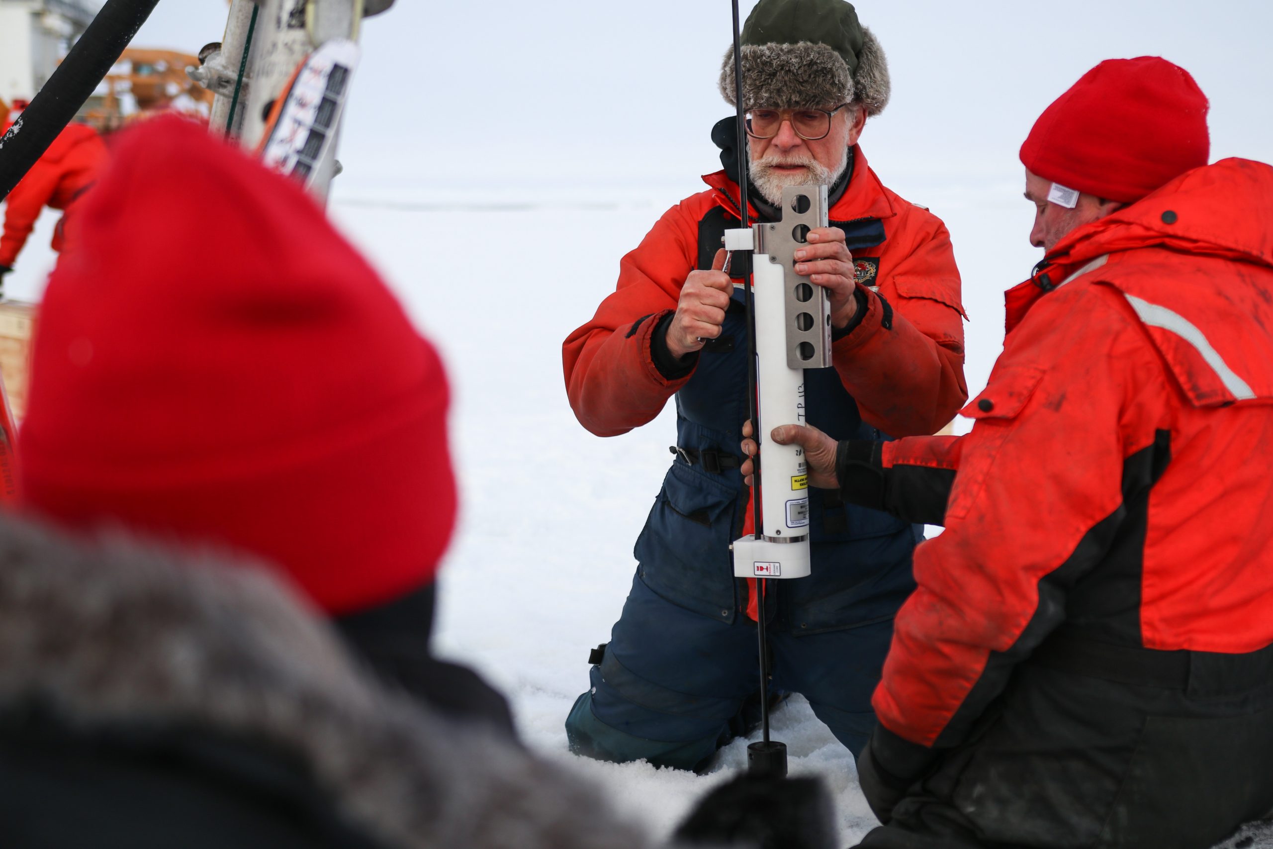 Frank Bahr clamps one of the microcats to the ITP tether. (Photo by Matthew Norenberg)