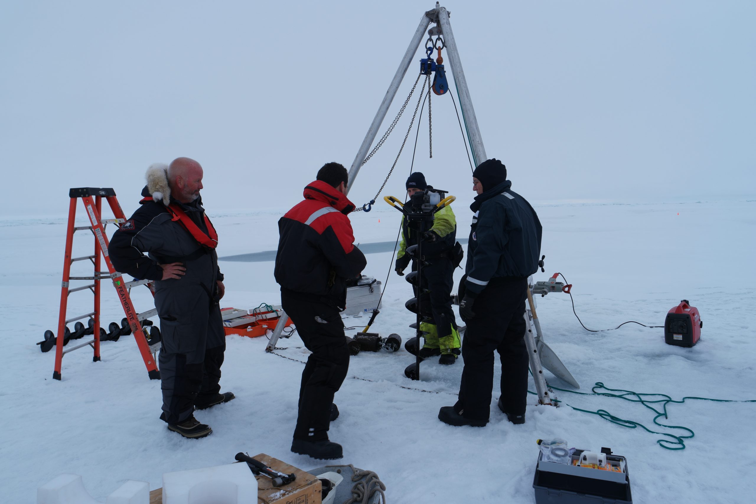 Augering the 10.5” hole through the ice floe.  (Photo by Hanne Sagen)