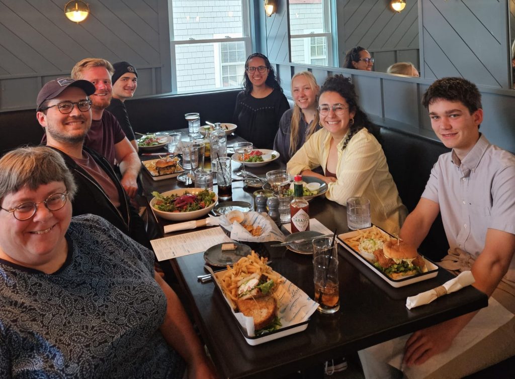 Group 2026 (Corinne's farewell dinner) Nathan Rayburn, Trevor Milliken, Kaden Martin, Chris Brothers, Aline Correa, Corinne Richard, Laura Motta, and Kunio Saito