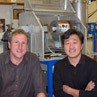 Post-docs Albert Benthien and Baoxi Han with the gas-ion source in 2004.