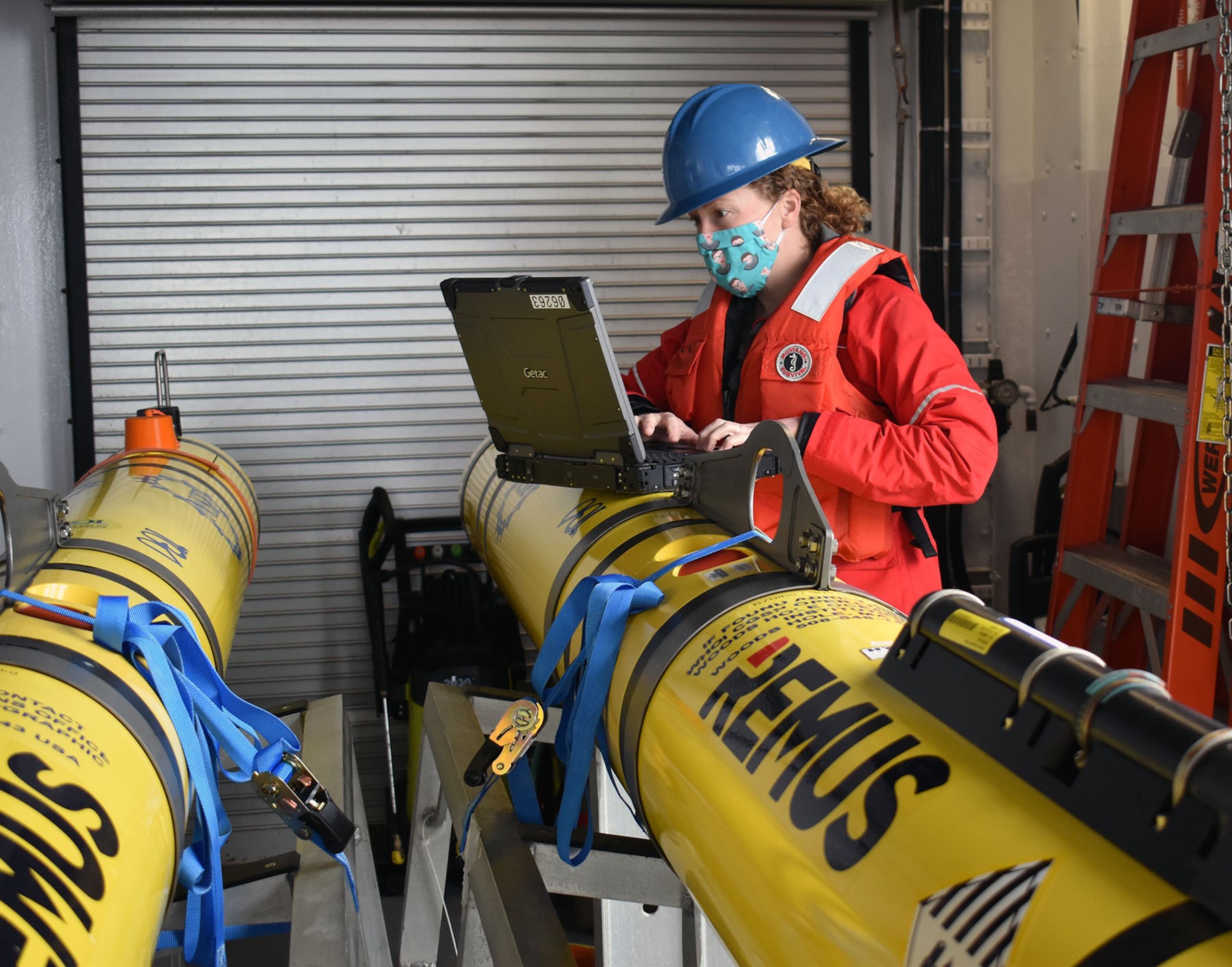 Senior Engineering Assistant prepares Autonomous Underwater Vehicles for deployment on pre-programmed missions between Pioneer moorings.  Photo: Rebecca Travis@WHOI.