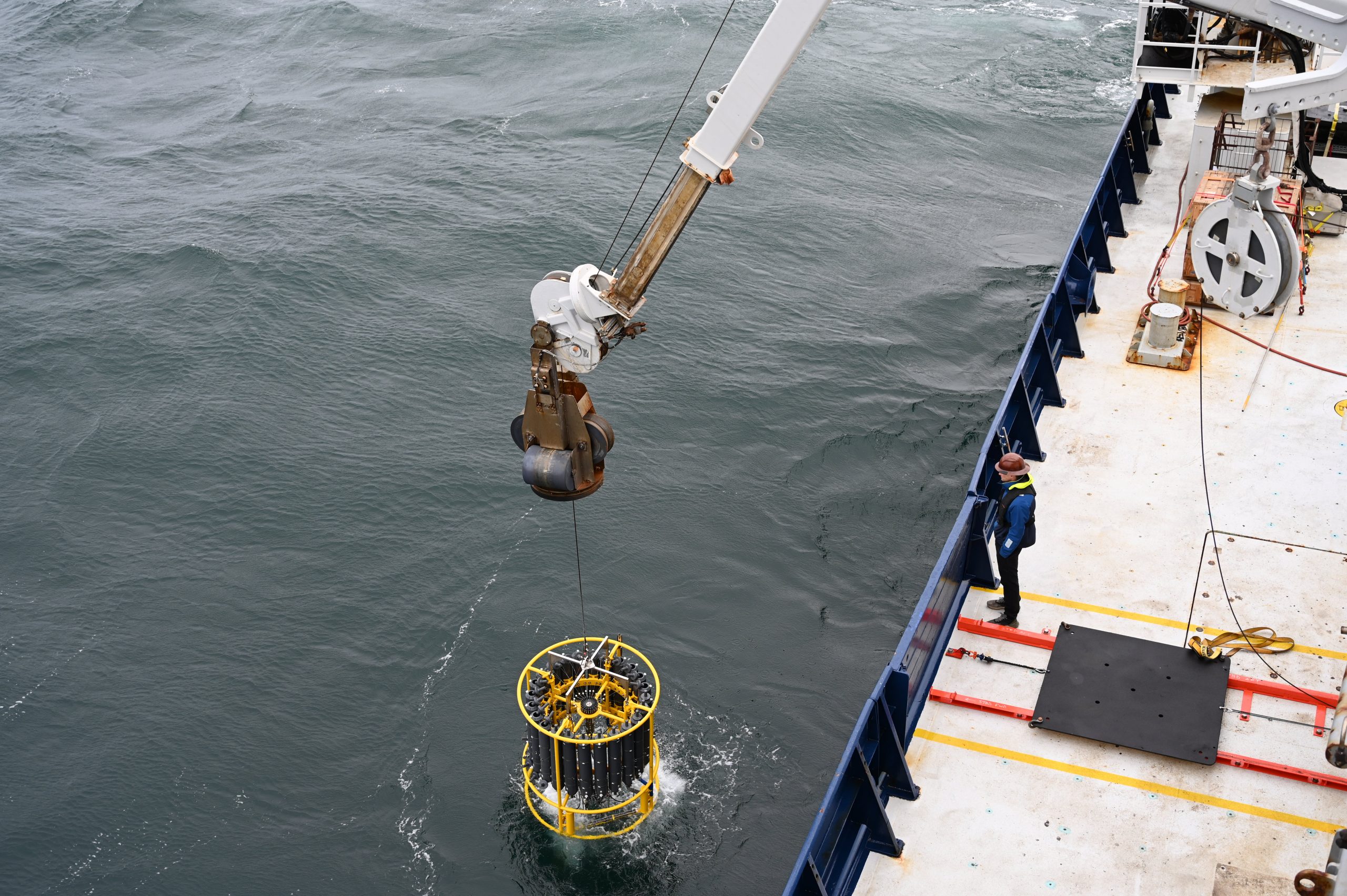 LIN_0396 The CTD rosette enters the water.