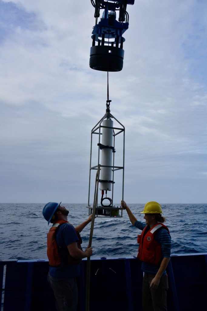 While waiting for calmer seas, Chris Basque and Diana Wickman lowered a bioacoustic sonar instrument into the water 
so its samples could be compared and validate results gathered by a ship-based bioacoustics sampler. 
