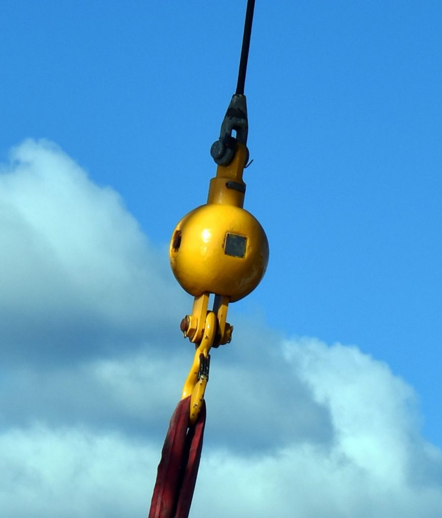 A working crane has a weighted sphere at the hook end to maintain tension on the line. Photo: Rebecca Travis©WHOI.