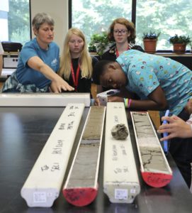 Roosen with students looking at cores