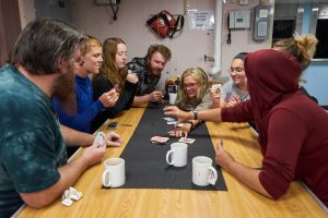 A little down time between stations is well spent with heated games of kemps (RR2004, 2021)