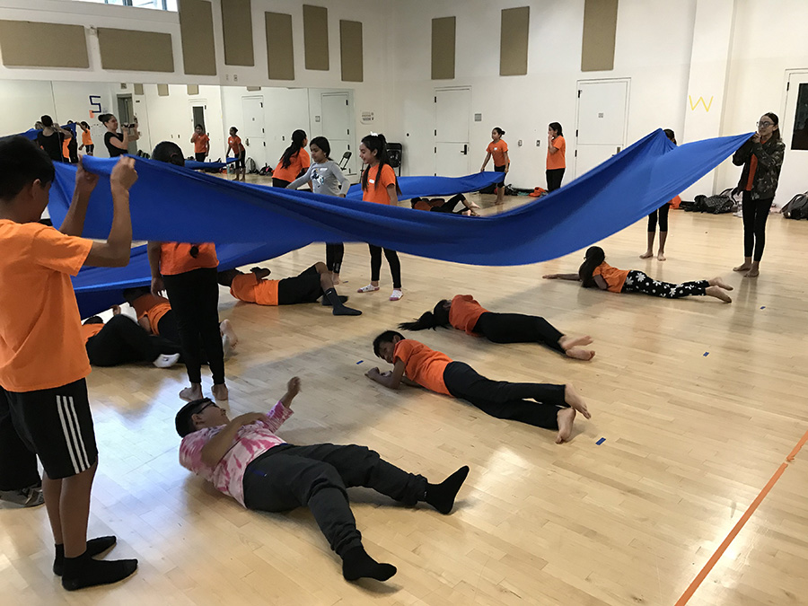 Students at A Step Beyond have fun reproducing the movement of ocean surface waves.
